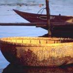 A small basket boat on the river at Hoi An.