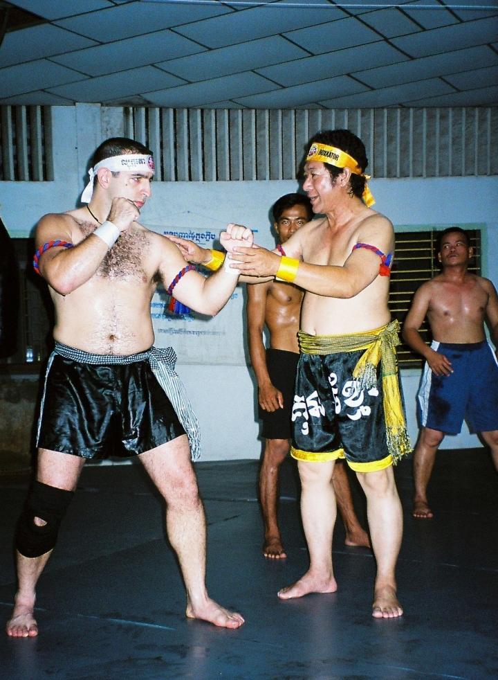 Antonio Graceffo (left) learns the Khmer martial art of Bokator under the watchful eyes of Master San Kim Saen in Phnom Penh.