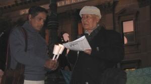 Poetic Justice: Sin Kye (immediate right) reads out a tribute to Cyclone Nargis victims 