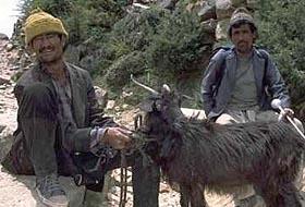 Villagers with a goat & a brass ladel, on the trail to Dharapuri, Nepal.