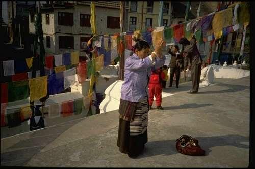 Tibetan pilgrim at the Great Stupa at Boudhnath, the spiritual and commercial center of the Tibetan community in the Kathmandu Valley