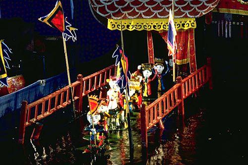 Flags are hoisted to signal the start of the show - springing up from beneath the water's surface; they somehow emerge completely dry.