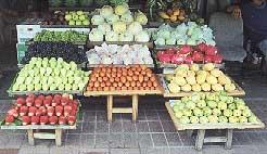 Chances are, if you're eating at the restaurant next door to this streetside market, you'll be eating these very fruits and vegetables, as a part of your food or a la carte. No industrial-size cans of pineapple slices in this town, mister.