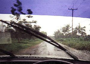 A rainstorm in southern Thailand seen from behind the wheel.