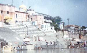 Lining the holy river are buildings like these, the bottoms of their long stairs reaching well below the surface. People come here to wash, frolic, or sit in quiet contemplation.
