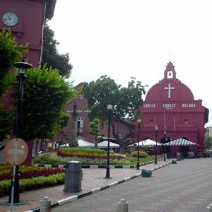 Christ Church Building with the Town Square's Clock Tower in the foreground.