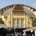 Exterior of Central Market, Phnom Penh, Cambodia. The yellow Art Deco style cavernous building seems incongruous and alien to its surroundings.