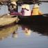 Small boats on the bank of the Thu Bon River. From the 17th to the 19th centuries Hoi An was among the most active ports in Southeast Asia. Today, fishing boats still go down the Thu Bon River to the South China Sea for their catch.