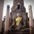 Buddha image in front of Wat Phra Prang at historical park