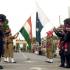 Pakistani paramilitary troopers with their Indian counterparts lower down their respective national flags at the Joint Check Post (JCP) at the Wagah border crossing between Pakistan and India.