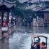 Wuzhen, Zhejiang, China. Visitors take a cruise on the Beijing-Hangzhou Grand Canal, thru Wuzhen.