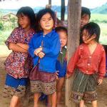 Hmong children at Thong Hai Hin on the Plain of Jars. This hilltribe community has been resettled just outside the provincial capital.