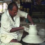 As the wheel turns, the clay seems to become liquid, flowing gracefully between Krishnan’s fingers.