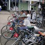 Rickshaw drivers lay in wait for customers.