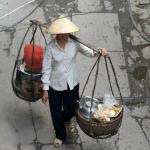 Basket lady carrying her mobile tea stand