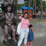 My girl and I with a statue at Baywalk