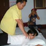 Thai massage at Wat Po, Bangkok, Thailand.