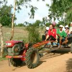 The author Jim Algie on a "gas buffalo" in Thailand
