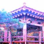 Sunrise gilds a pavilion of Naksansa Temple, near the seashore.