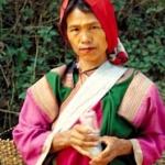 Traveling through the forest one often encounters locals, like this Lisu woman, walking the trail.