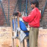 Street side barbershop in downtown Delhi