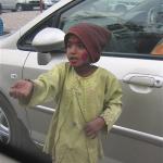 Every time our car stopped at a street light in India a beggar came to the window