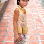 A girl from one of the neighboring farms was shy yet fascinated by all the strange guests.
