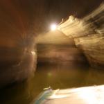 There's nobody in these caves but us. The only sounds are our voices and the oars slapping the water.