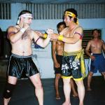 Antonio Graceffo (left) learns the Khmer martial art of Bokator under the watchful eyes of Master San Kim Saen in Phnom Penh.
