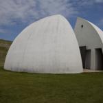 Moerenuma Park is a municipal park  designed by Isamu Noguchi.  The park is considered to be one complete sculpture.  Shown is a  modern,  white rest room facility. 