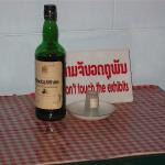 Communist leader Kaysone's whiskey bottle and glass