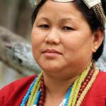 A Aka Tribal woman of West Kameng district of Arunachal Pradesh wearing a traditional headgear made of Silver