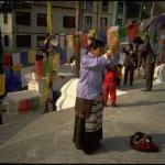 Tibetan pilgrim at the Great Stupa at Boudhnath, the spiritual and commercial center of the Tibetan community in the Kathmandu Valley