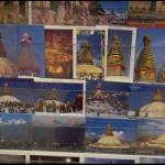 Postcards of the Boudhnath stupa on sale on the kora around the sacred monument, Kathmandu