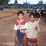 A brother and sister take a break from their sales duties and pose in front of the famous Angkor Wat temple.
