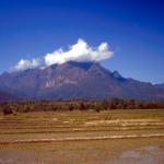 The chiseled features of Chang Dao mountain capped by cloud.