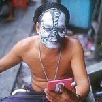 Chinese opera artiste prepares for the evening performance at Georgetown's Kuan Yin (Goddess of Mercy) Temple, which dates back to the year 1800.