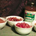 Homemade Pineapple, Watermelon Rind, Peach and Apple chutneys, with a jar of traditional Mango Chutney.