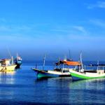 DILI, EAST TIMOR: Fishing boats make a colourful spectacle, off Meti'aut Beach.