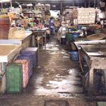 I have always found the phrase "fresh market" (talaht sot in Thai) to be something of a misnomer, and the market itself somewhat repellant. The food may be fresh, but the market is grim, the atmosphere stale. Hay and vegetable matter and flesh go to rot in buildings and under canopies that admit little light. The vendors do what they can, but the ritual sweeping of animal juices into sewer grates only partially diminishes their fetid effect, while fans dismally spinning overhead only move the dust around.