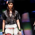 A model presents an outfit designed by Thai designer Medium-Rare as she walks the ramp at the Bangkok Fashion Week 2005, at Queens Sirikit Conventional Center in Bangkok.