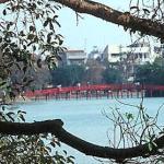 Thê Huc ('Rising Sun') Bridge leads to Ngoc Son Temple in Lake Hoan Kiem, Hanoi, Vietnam.
