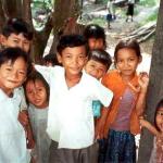 Kids in Sandal cautiously approach a stranded foreigner.