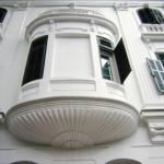 The Metropole's trademark white facade with green shutters