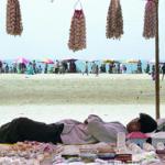 A vendor enjoys a nap on a beach in Cox's Bazar resort, 06 December 2002. Bangladesh's fledgling but troubled tourism industry is slowly luring foreign and domestic travellers with one of the most popular destinations this winter being this beach resort town of Cox's Bazar on the Bay of Bengal, which drew sun-worshippers from as far away as Europe and Southeast Asia.