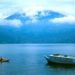 The volcanic cone of Gunung Seminung (1881 metres), rises above Lake Ranau.