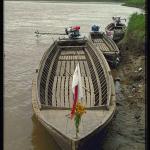 Large teak-hulled ferries await passengers.