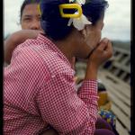The natural beauty of the Burmese girls is further enhanced with flowers and cheeks brushed with Tanakha powder.
