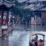 Wuzhen, Zhejiang, China. Visitors take a cruise on the Beijing-Hangzhou Grand Canal, thru Wuzhen.