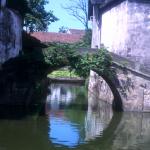 Life imitates art in much of China's landscape, and this ancient bridge creates a watery illusion.